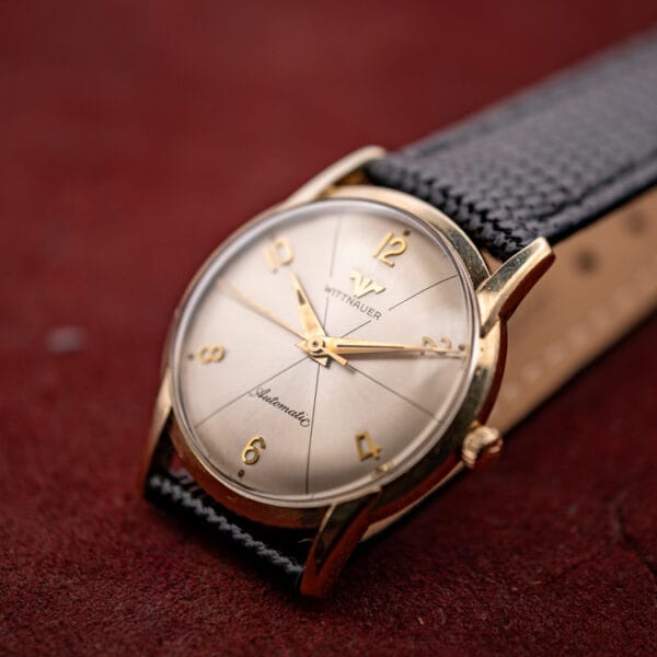 Wittnauer 2673-11SR silvered dial radial sector pattern with applied gold Arabic numerals and dauphine hands
