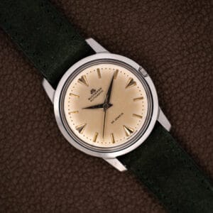 Vintage Bucherer automatic Ref. 6232 eggshell patina dial with gilt dart markers on forest green suede strap