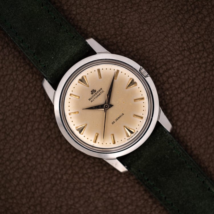 DSCF4638 Vintage Bucherer automatic Ref. 6232 eggshell patina dial with gilt dart markers on forest green suede strap