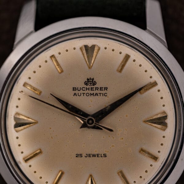 Bucherer 6232 dial close-up showing crowned BUCHERER crest, AUTOMATIC signature and applied gilt faceted markers