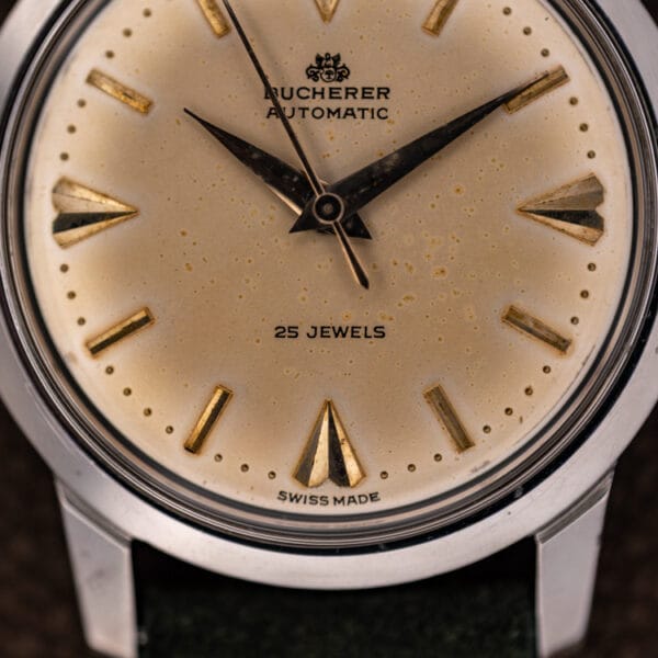 Bucherer automatic 6232 dial detail with 25 JEWELS and SWISS MADE text and warm even foxing