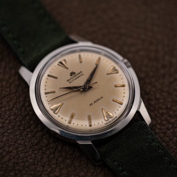 Bucherer Ref. 6232 dial at an angle with crowned crest, dauphine hands and gilt dart markers