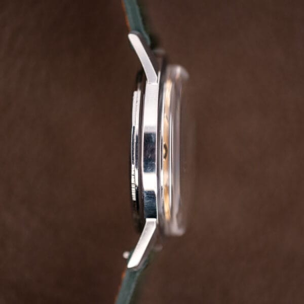 Vintage Bucherer automatic 6232 case side profile showing slim polished steel band and lugs