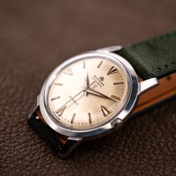 Bucherer automatic 6232 eggshell patina dial and steel case on brown leather, three-quarter view