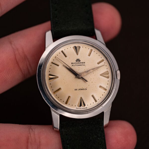 Bucherer automatic 6232 in fingers, eggshell dial and green suede strap, 35mm case