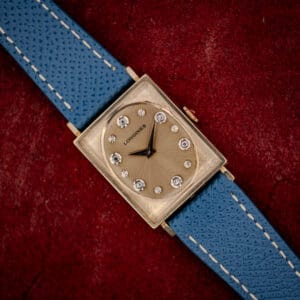 Vintage Longines Tank ref. 3007-528 champagne gold dial with diamond and star markers on a blue leather strap