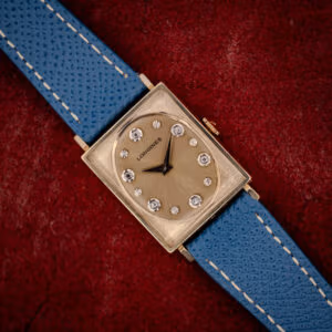 Vintage Longines Tank ref. 3007-528 champagne gold dial with diamond and star markers on a blue leather strap