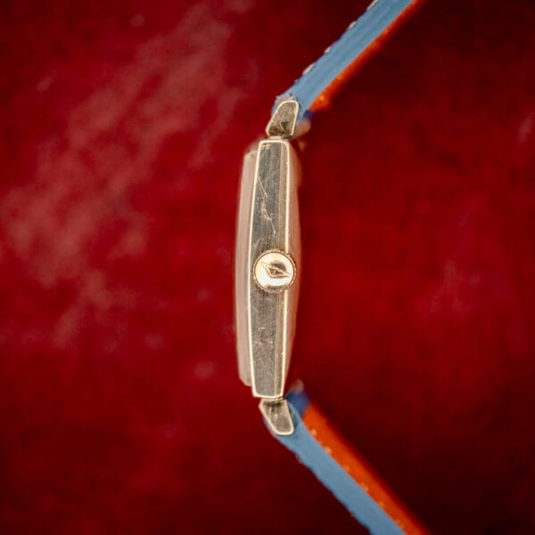 Longines 3007-528 side profile showing the signed winged-hourglass crown and a gently worn case flank