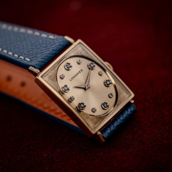 Vintage Longines 3007-528 rectangular gold filled case and diamond dial photographed at a low angle