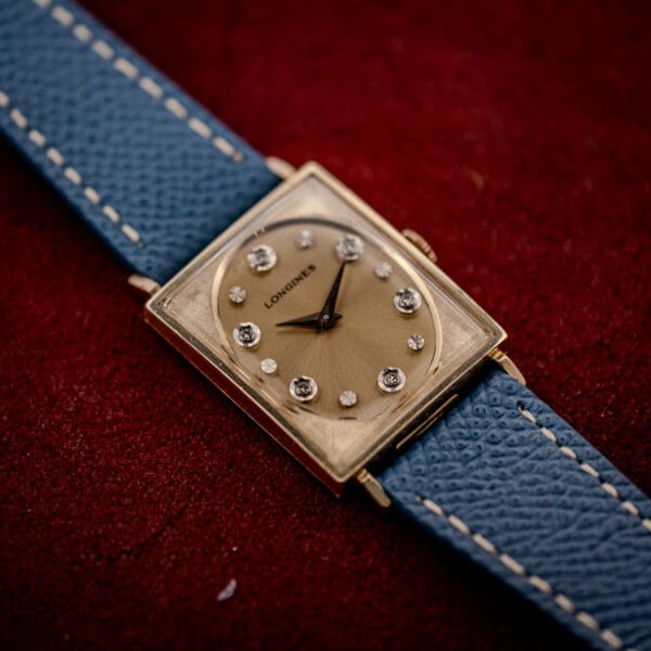 Longines Tank 3007-528 champagne sunburst dial and blue grained leather strap viewed from the side