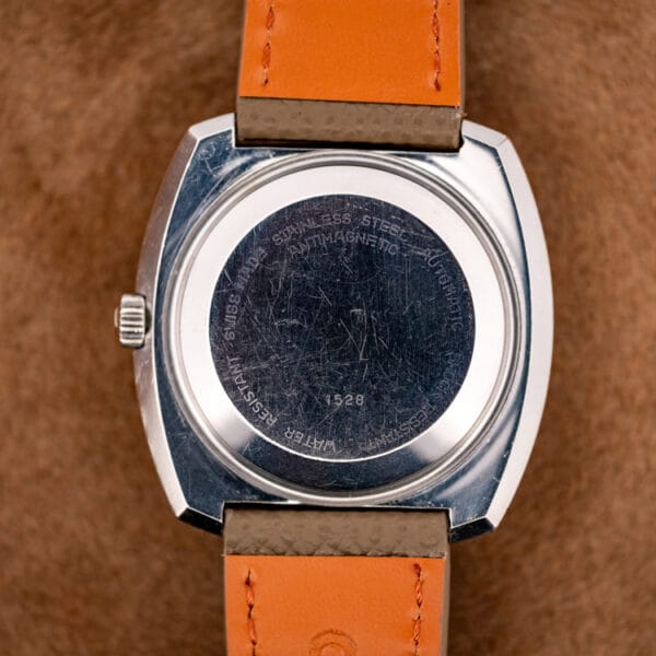 Bucherer snap caseback stamped SWISS MADE STAINLESS STEEL AUTOMATIC ANTIMAGNETIC WATER RESISTANT with case number 1528