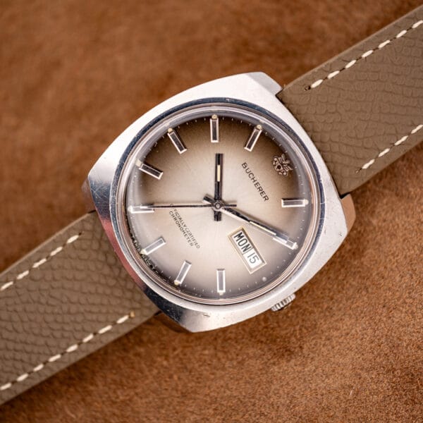 Bucherer 2630/2728 cushion stainless steel automatic chronometer, ombre dial angled under warm light