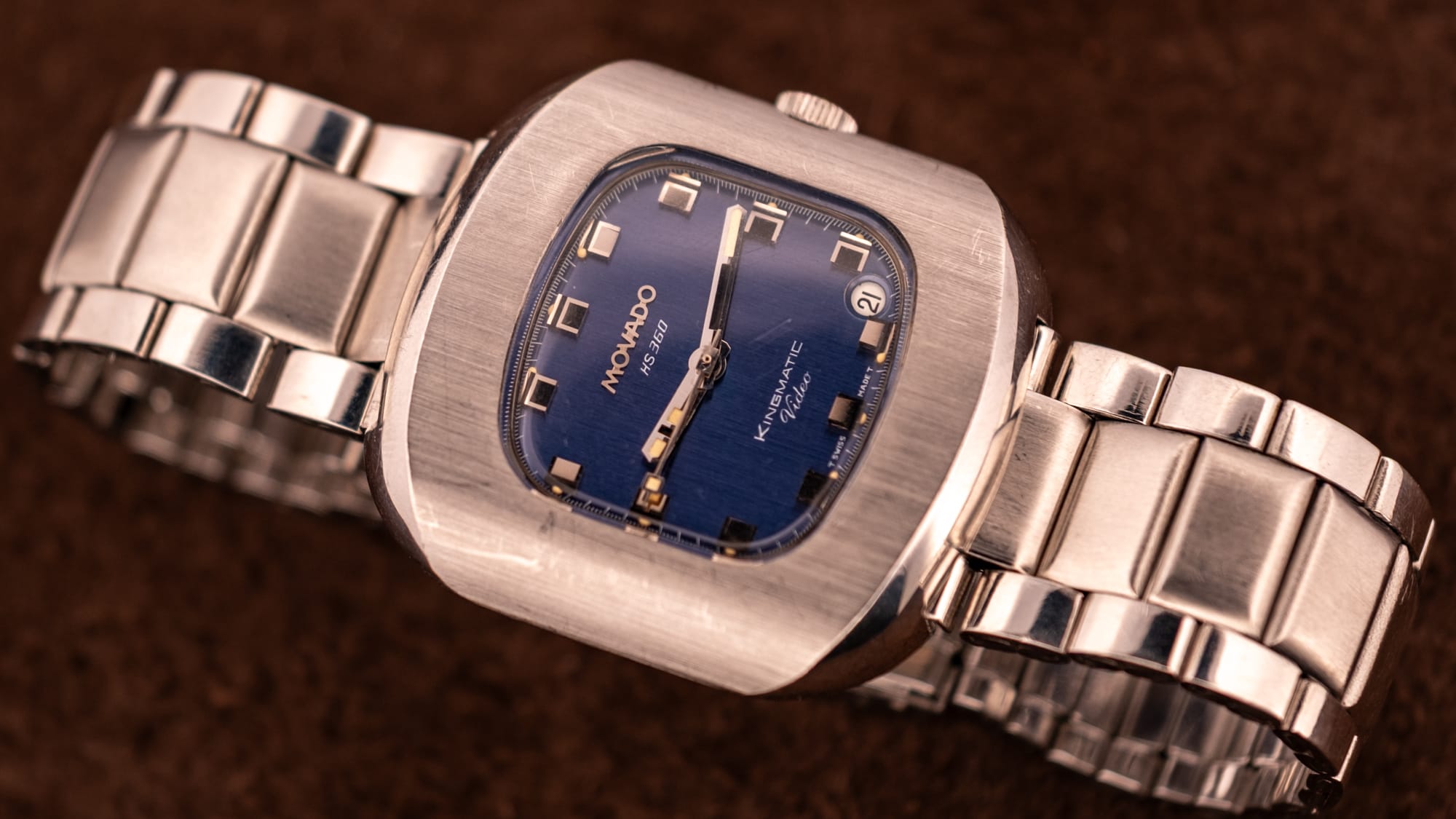 Vintage Movado Kingmatic HS 360 with a blue dial and date in a stainless steel cushion case on a steel bracelet