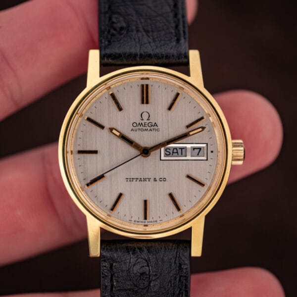 Front view of the Omega 166.0117 silver dial with gold markers, day-date at three and the Tiffany and Co. signature