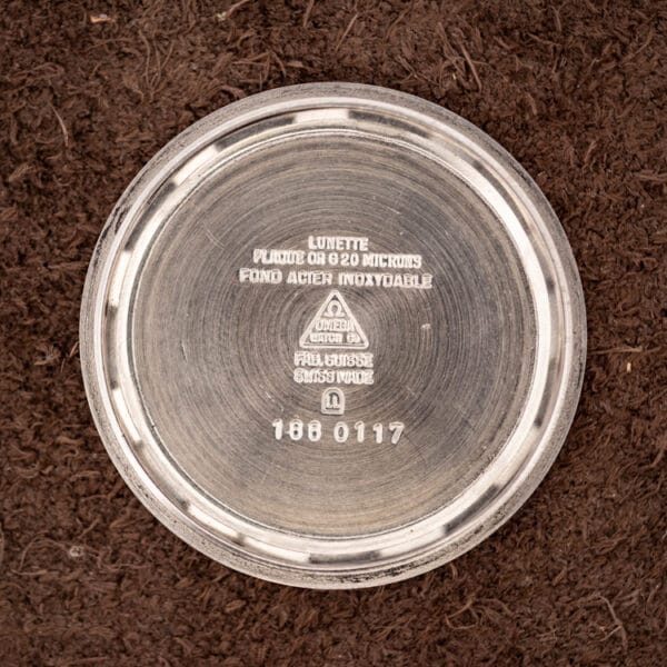 Omega inner caseback stamped PLAQUE OR G 20 MICRONS, FOND ACIER INOXYDABLE and reference 166 0117