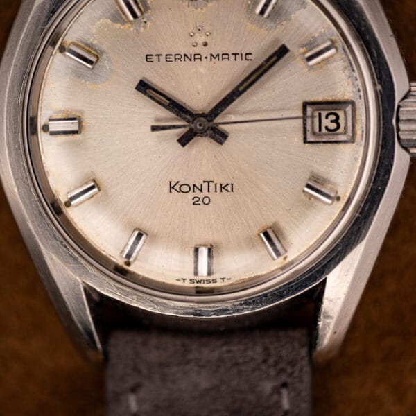 Eterna KonTiki 20 dial macro showing the five-dot Eterna-Matic logo, applied baton markers and T Swiss T tritium text