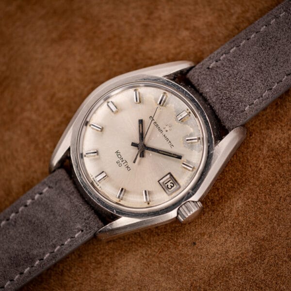 Eterna KonTiki 20 ref. 130FTT cushion stainless steel case three-quarter view on grey suede strap