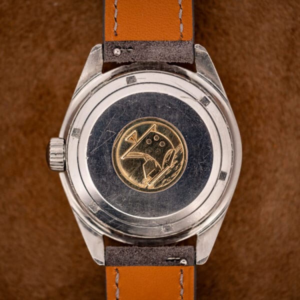 Eterna KonTiki 20 stainless steel caseback with the gold Kon-Tiki reed-raft medallion emblem