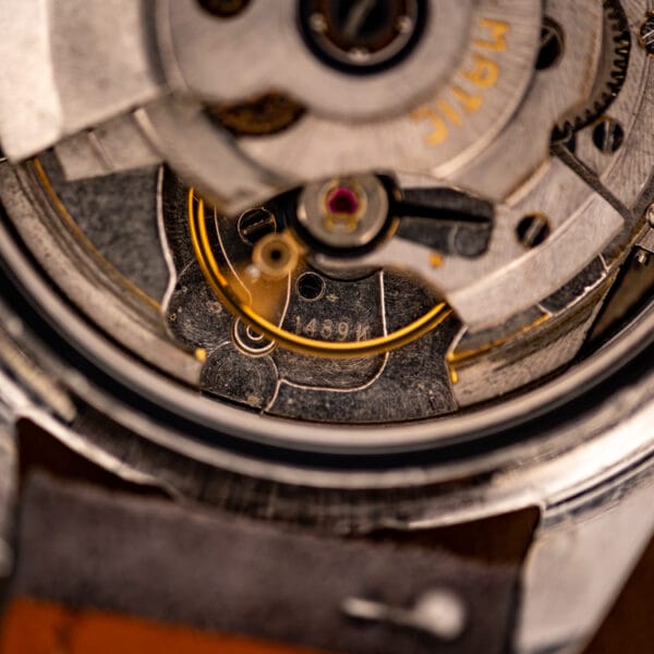 Eterna caliber 1489K stamping on the movement bridge beside the jeweled balance and rotor
