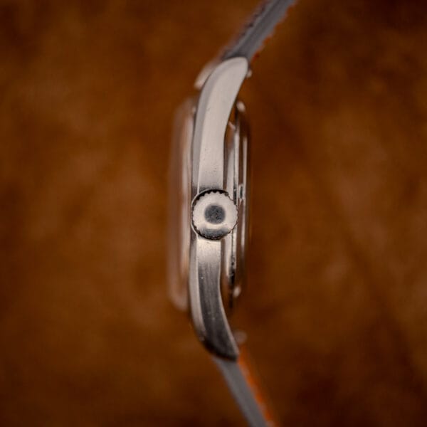 Eterna KonTiki 20 case side profile showing the fluted crown and brushed stainless steel band