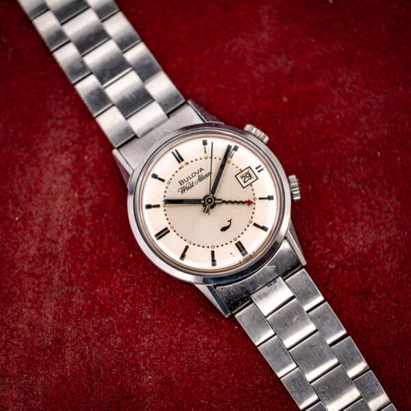 Bulova Sea King Wrist Alarm ref. 773 stainless steel case angled on its signed folding bracelet