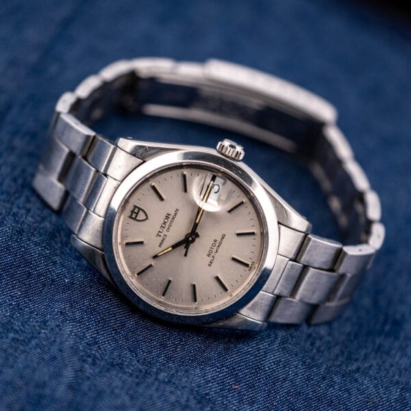 Tudor Prince Oysterdate 74000N angled on denim, coronet crown and domed crystal in view
