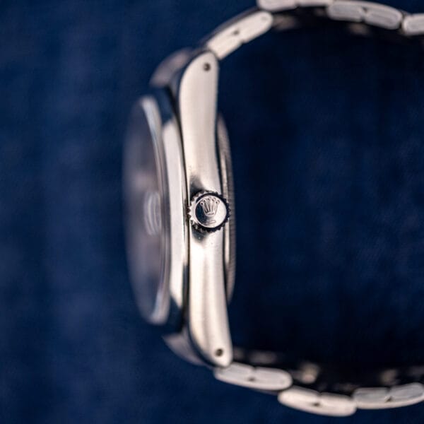 Tudor 74000N screw-down winding crown macro showing the Rolex coronet and case profile