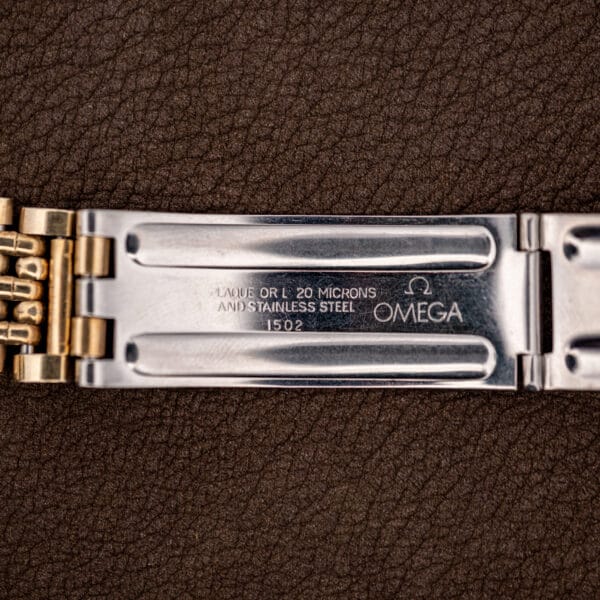 Omega folding clasp stamped PLAQUE OR L 20 MICRONS AND STAINLESS STEEL and reference 1502 with Omega logo