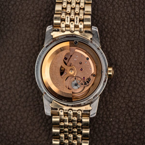 Omega caliber 501 full-rotor automatic movement signed OMEGA WATCH Co SWISS with copper-rose rotor