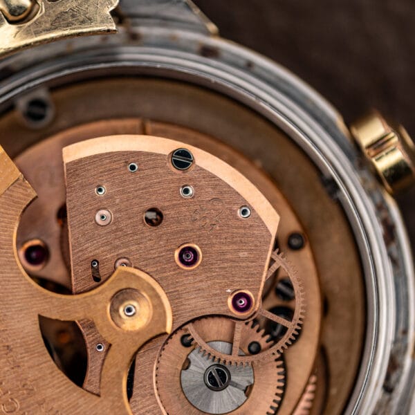 Omega caliber 501 movement bridge stamped with the Omega symbol and 501 caliber number