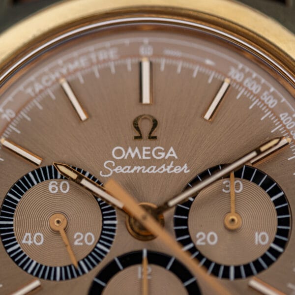 Omega Seamaster 145.029 mocha dial detail with gold Omega logo, Seamaster script and black-ringed chronograph sub-register