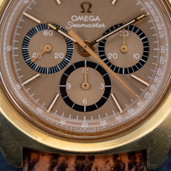 Omega 145.029 dial showing three black-ringed sub-registers and T SWISS MADE T tritium marking at the foot