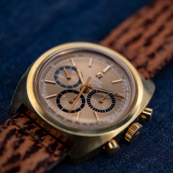 Omega Seamaster 145.029 chronograph, gold-plated cushion case with round pushers and signed crown, angled view