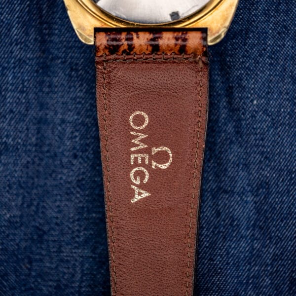 Underside of the brown sharkskin strap stamped OMEGA, original Omega band for the Seamaster 145.029