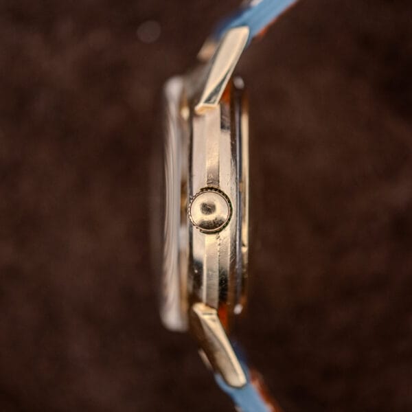 Longines 2269-1 case profile showing the fluted crown, polished gold filled flank and domed acrylic crystal