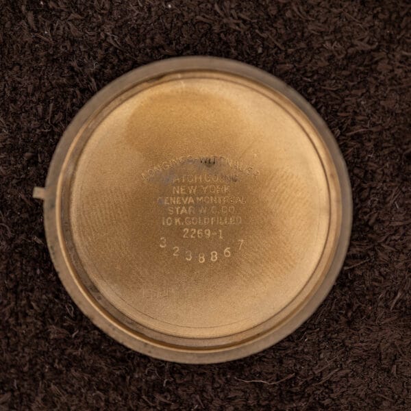 Inner caseback stamped LONGINES-WITTNAUER WATCH CO INC NEW YORK, STAR W.C. CO. and reference 2269-1