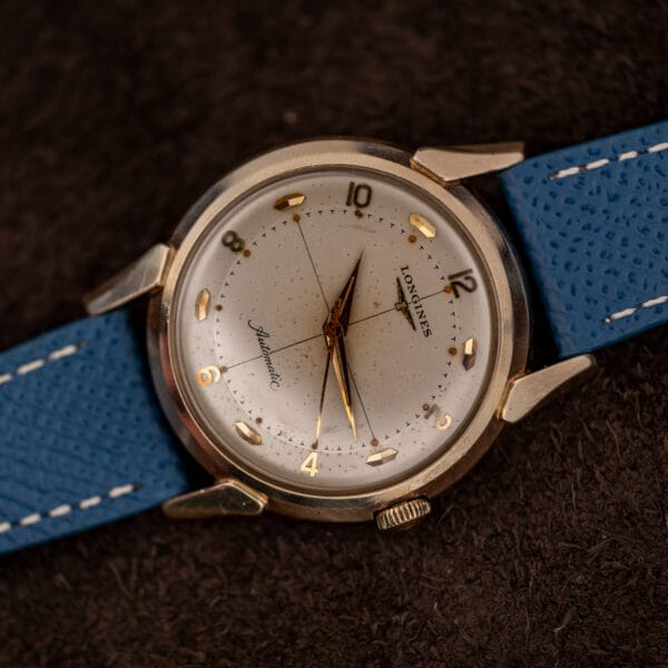 Longines 2269-1 rotated view, the printed crosshair running the full width of the silvered dial past the winged logo