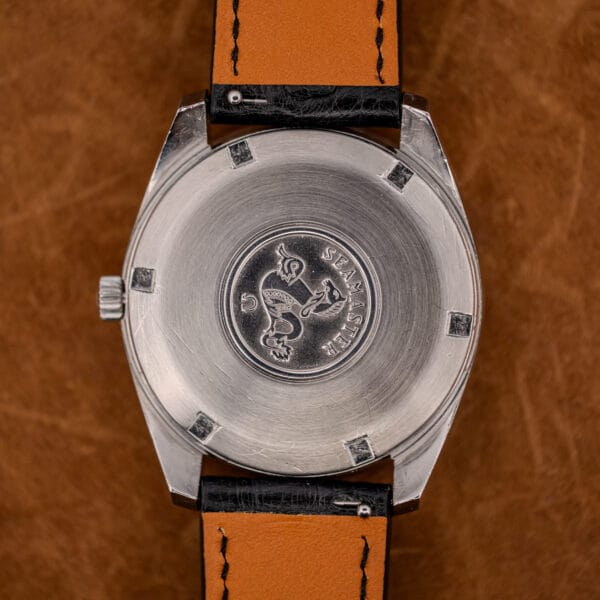 Stainless steel Seamaster caseback of the Omega 168.022 with the raised hippocampus seahorse medallion.