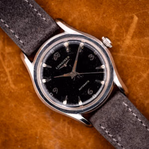 Vintage Longines automatic ref. 6536-1 black dial with ornate Arabic numerals on anthracite suede strap, bombe steel case