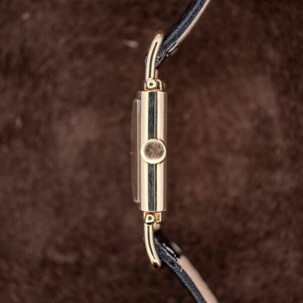 Hamilton Wilshire side profile showing the fluted crown and the hinged pivots of the flexible driver's lugs