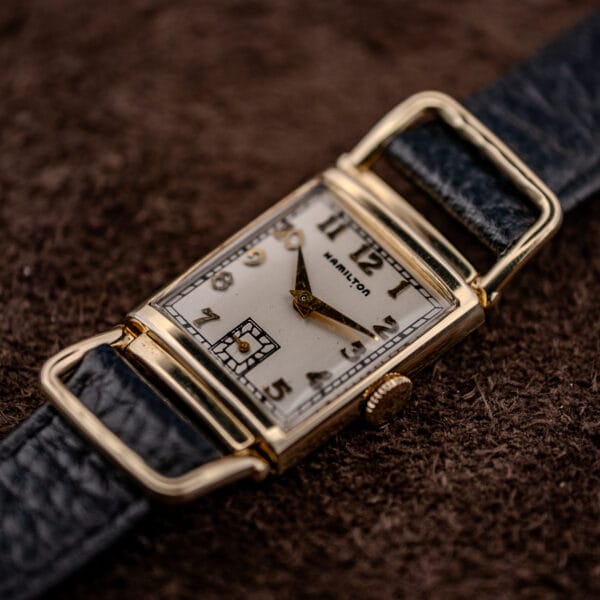 Hamilton Wilshire 14k gold filled driver's watch, full silvered dial and looping flexible lugs on brown suede