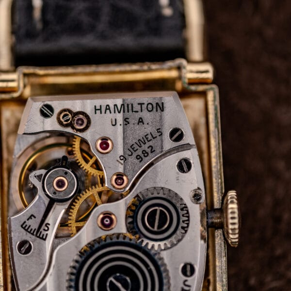 Hamilton 982 movement macro showing the 19 JEWELS 982 signature and graduated fast-slow regulator scale