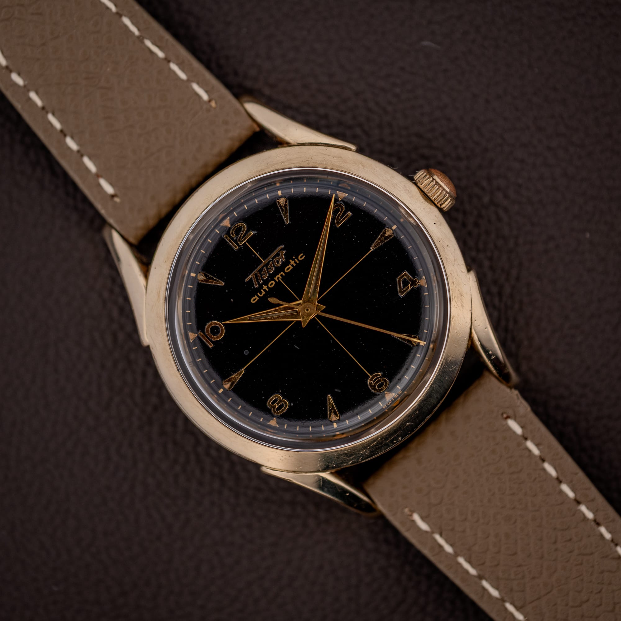 DSCF5021 Vintage Tissot bumper automatic black gilt cross-hair dial with gold Arabic numerals on a mud grey leather strap