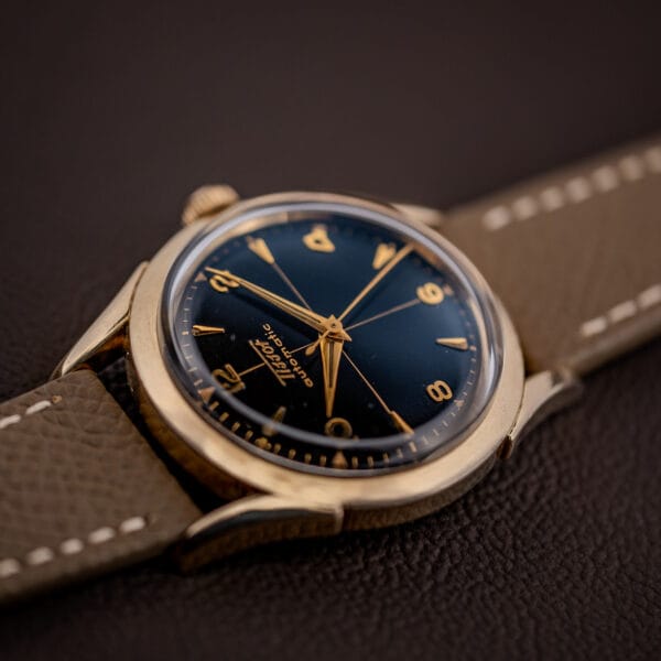 Vintage Tissot black gilt cross-hair dial angled macro, the gilt Tissot Automatic signature catching light