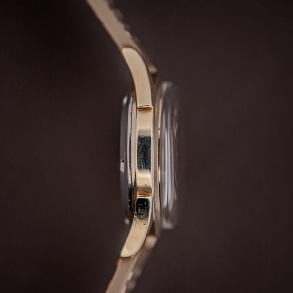 Vintage Tissot side profile, 10K gold-filled bezel over stainless back and a domed plexi crystal