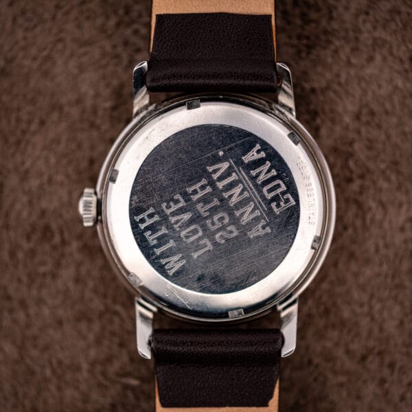 Girard-Perregaux Gyromatic steel caseback hand-engraved for a 25th wedding anniversary, marked STAINLESS STEEL