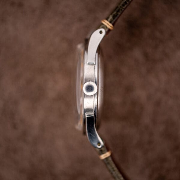 Omega automatic bumper 2421/4 case profile showing fluted crown, slim caseband and downturned lugs