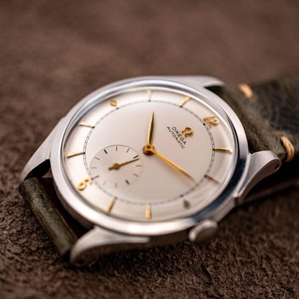 Omega automatic bumper 2421/4 three-quarter view, applied gold markers and long faceted gold hands