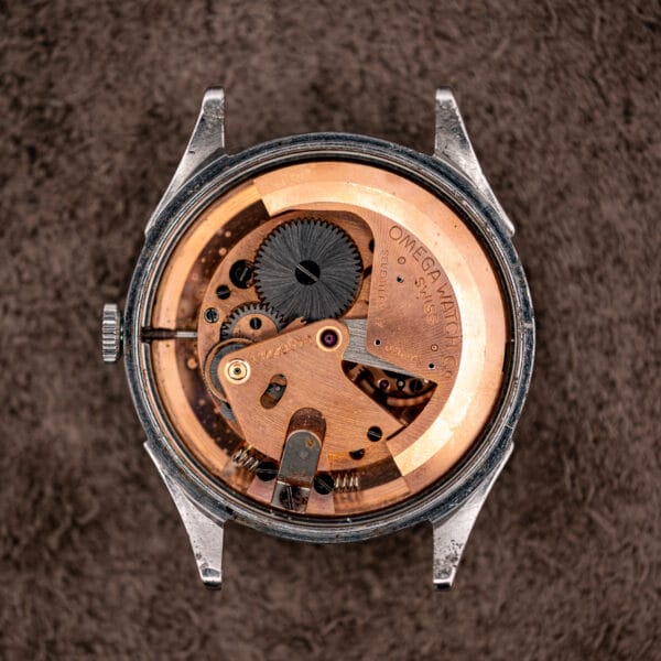 Omega caliber 28.10 RA bumper movement in its 2421/4 case with exposed coil buffer springs at the base