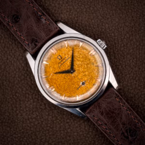 Omega Seamaster 2937-5 tropical dial with honey-to-cream freckled patina on a choco brown ostrich strap